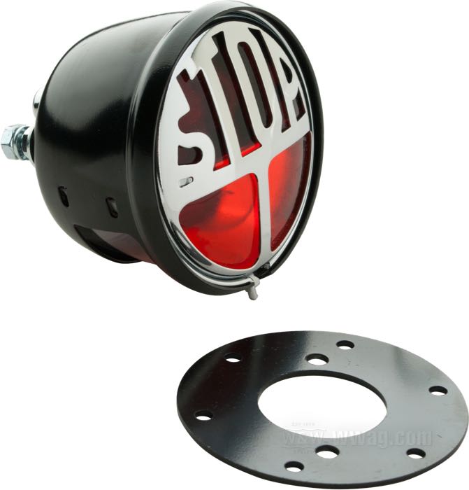 Fanalino posteriore »Stop«; acciaio, nero, sua griglia decorativa cromata „Stop“; profondità: 48 mm; Ø 68 mm; tipo di lampadina: T10W; 12 V; basetta: BA15s (2x); con lampadina/e; senza blocchetto di montaggio; con luce freno; con illuminazione targa; peso lordo: 190 g