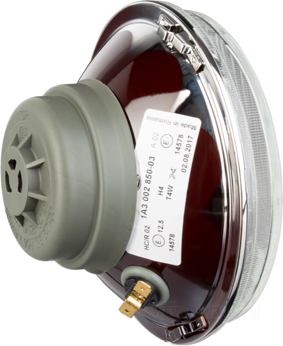 Headlight insert »H4 + Parking« by Hella; steel / glass, fluted; Ø 5-3/4”; bulb type: H4 / T4W; 6 or 12 V; socket: P43t / BA9s; without bulb; with position light function; replaces OEM HD 67696-81A, 67698-81B, and 67757-92; E1 approved; Europe; gross weight: 470 g