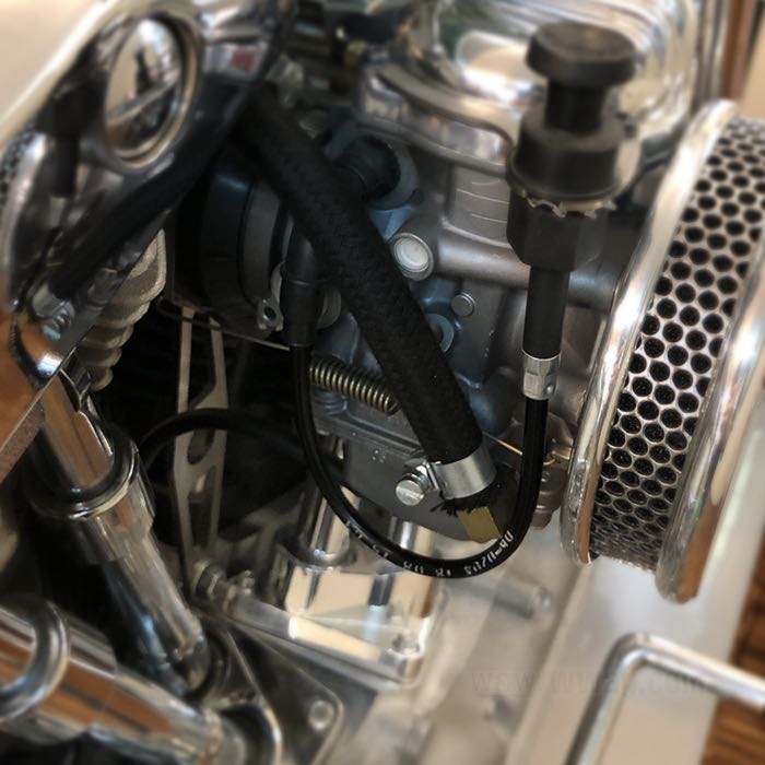 Mounting kit by Bates; for Keihin CV carburetors 1988→; for Tillotson, Bendix and Keihin (butterfly) manifolds; stainless steel / spring steel; Spigot Ø: 42 mm; mounting hole distance: 70 mm; gross weight: 157 g