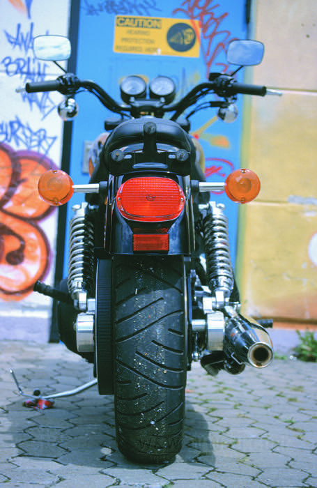 Taillight; fits Sportster (exc. XL1200C/CP) and Dyna 1999-2020, Softail 2000-2017; plastic, red; 12 V; 27/7 W; with bulb(s); with stop light; with license illumination; without license bracket; mounting surface: curved; replaces OEM HD 68141-04; E11 approved; Canada; gross weight: 330 g