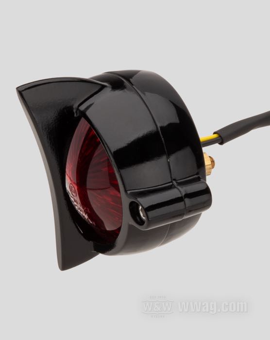 Taillight »Cuda« by Motone; cast aluminum, black, painted; depth: 55 mm; Ø 62 mm; thread: #10-32; 12 V; with LED; with stop light; with aluminum housing; with license illumination; mounting surface: flat; with four nuts; E4 approved; gross weight: 181 g