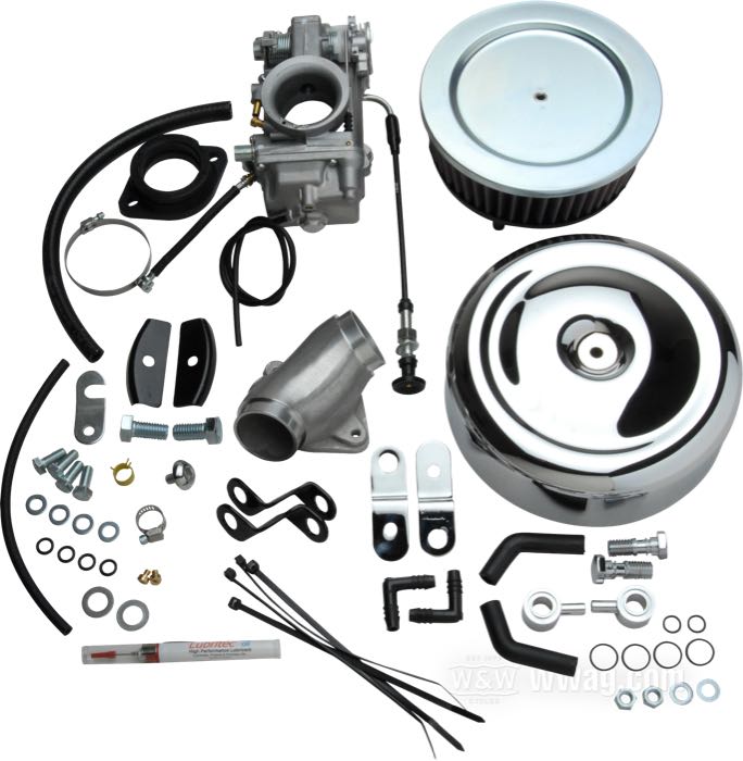 Carburatore a valvola »HSR42« di Mikuni; atto per Big Twin 1993-1999; alluminio fuso / acciaio; con collettore, fascette e filtro aria con coperchio cromato; peso lordo: 3.82 kg